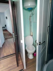 a small bathroom with a toilet in a room at Hotel Uyut in Bilhorod-Dnistrovskyi