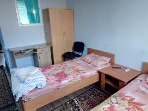 Postel nebo postele na pokoji v ubytování Hotel Uyut