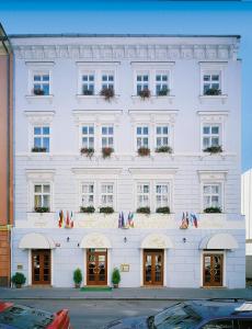 a large white building with a lot of windows at Arbes in Prague