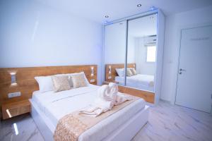 מיטה או מיטות בחדר ב-Orel Apartments - דירות אוראל