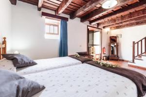A bed or beds in a room at El Pósito