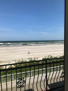 a view of the beach from a balcony at Zajazd Dajana in Ustka