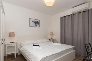 Postel nebo postele na pokoji v ubytování Apartments Ivan Zaton