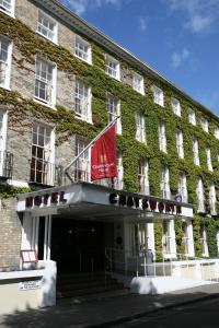 a building with ivy on the side of it at The Chatsworth Hotel in Worthing +26 photos