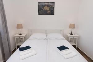 Postel nebo postele na pokoji v ubytování Apartments Ivan Zaton