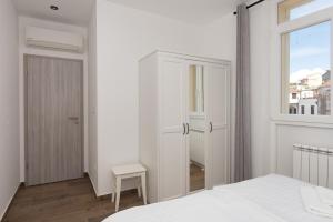Postel nebo postele na pokoji v ubytování Apartments Ivan Zaton