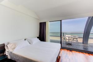 Кровать или кровати в номере Kursaal Hotel