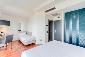 Кровать или кровати в номере Kursaal Hotel