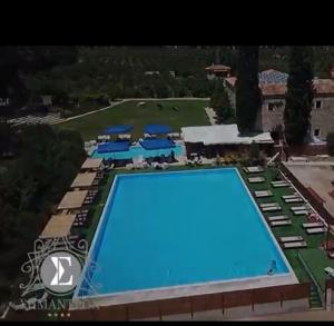 an aerial view of the pool at a resort at Semantron Traditional Village in Diakopto
