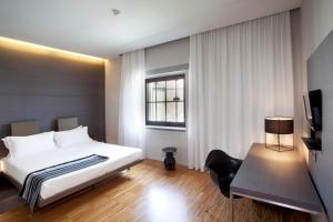 Postel nebo postele na pokoji v ubytování Alter Hotel