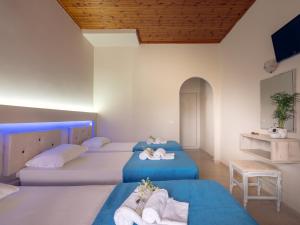 Postel nebo postele na pokoji v ubytování Savvas Hotel