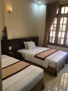 Cama o camas de una habitación en Ho Tay Hotel