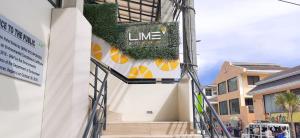 un edificio con un cartel en el costado en Lime Hotel Boracay en Boracay