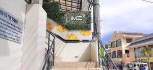 a building with a sign on the side of it at Lime Hotel Boracay in Boracay