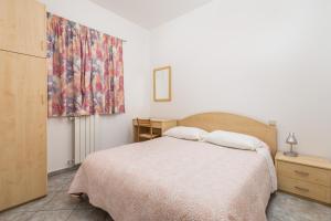 Ein Bett oder Betten in einem Zimmer der Unterkunft Apartments Gea