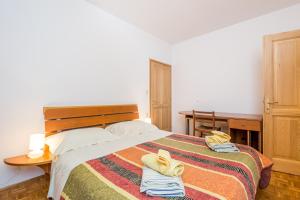 Ein Bett oder Betten in einem Zimmer der Unterkunft Apartments Gea