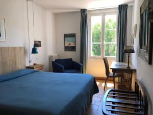 Postel nebo postele na pokoji v ubytování Le Manoir de Port-Cros + 37 fotografií
