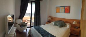 A bed or beds in a room at Playa Paraiso 27A