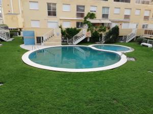 Bazén v ubytovaní Parquemar VIII Solo Familias Serviplaya alebo v jeho blízkosti