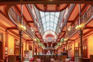 a large building with a skylight in the ceiling at Hôtel du Parc in Salies-de-Béarn