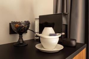 a black table with a mortar and a television on it at ION Adventure Hotel, Nesjavellir, a Member of Design Hotels in Nesjavellir