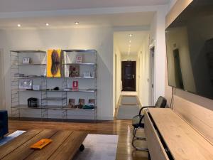 a living room with a flat screen tv and a couch at Volantin Apartment in Bilbao