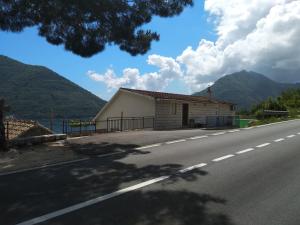 a house on the side of a road at Apartments Jovanović in Perast