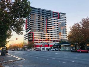 a large building on the side of a street at Central Escape @ Adelaide CBD in Adelaide