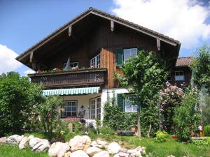 a dog standing in front of a house at Villa Laske in Altaussee