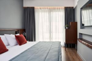 Cama o camas de una habitación en Hotel Achilleas