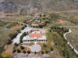 an aerial view of a large house with a driveway at Aetovigla Guesthouse in Krousón