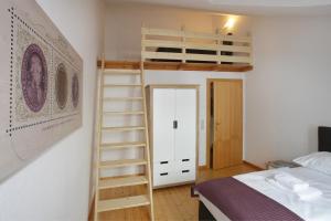 Łóżko lub łóżka w pokoju w obiekcie City Apartments Mozart