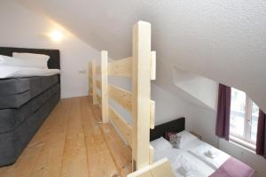 Łóżko lub łóżka w pokoju w obiekcie City Apartments Mozart