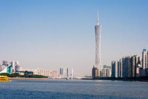 a view of a city with a bridge and buildings at Paco Hotel Gangding Metro Guangzhou-Free Shuttle Bus fir Canton Fair in Guangzhou