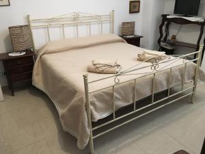 Postel nebo postele na pokoji v ubytování B&B Domus Gaetani