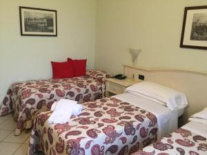 Letto o letti in una camera di Albergo Il Gufo