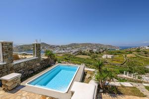 a swimming pool in a villa with a view at 9 Muses Villas Mykonos in Ornos