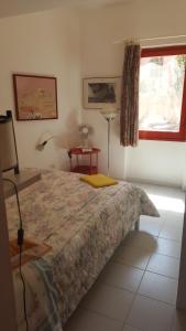 En eller flere senge i et værelse på la tonnara