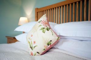 A bed or beds in a room at Cambo House 