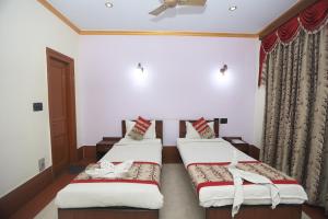 Postel nebo postele na pokoji v ubytování YMCA SEACOM INN