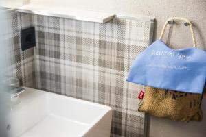 a towel hanging on a wall next to a sink at Hotel Rad in Tettnang