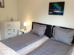 A bed or beds in a room at Biro Apartman