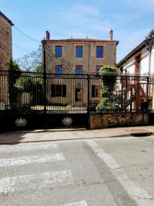 a wrought iron fence in front of a building at Maison de Maitre I in Availles-Limouzine