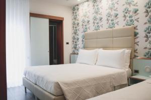 Кровать или кровати в номере Hotel Gaby