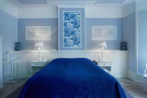 Un pat sau paturi într-o cameră la Vondelpark House B&B