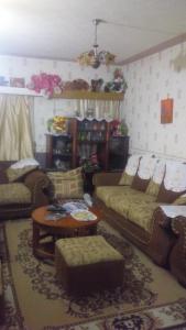 a living room with couches and a table at Juddy Place in Nairobi