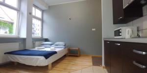 Postel nebo postele na pokoji v ubytování 999 Aparthostel