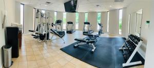 a gym with treadmills and cardio equipment in a room at Millennium Maxwell House Nashville in Nashville