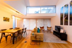 a living room with a couch and a table at H. S. Caloura in Lagoa