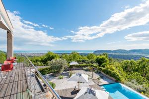 a view from the balcony of a villa with a swimming pool at Casa Colleverde in Castelnuovo Magra